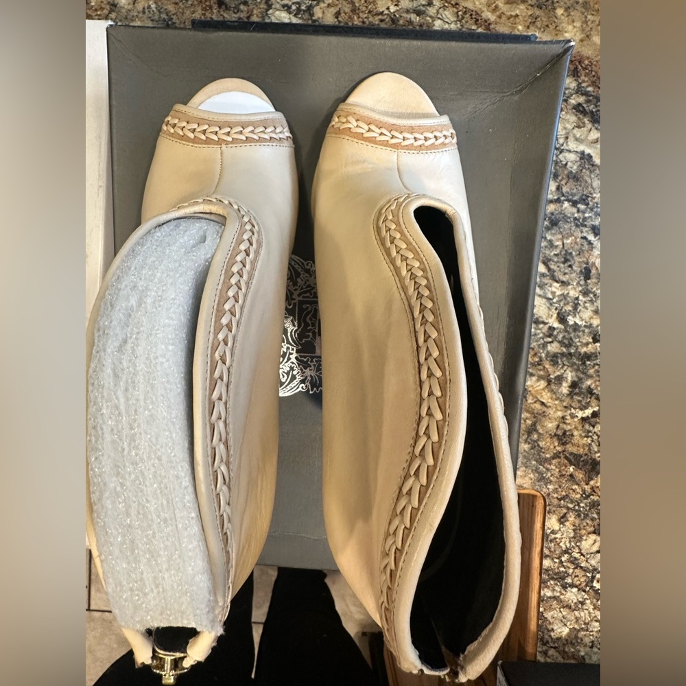 Women’s size 8.5 have Vince Camuto peep toe leather heels. Brand New!